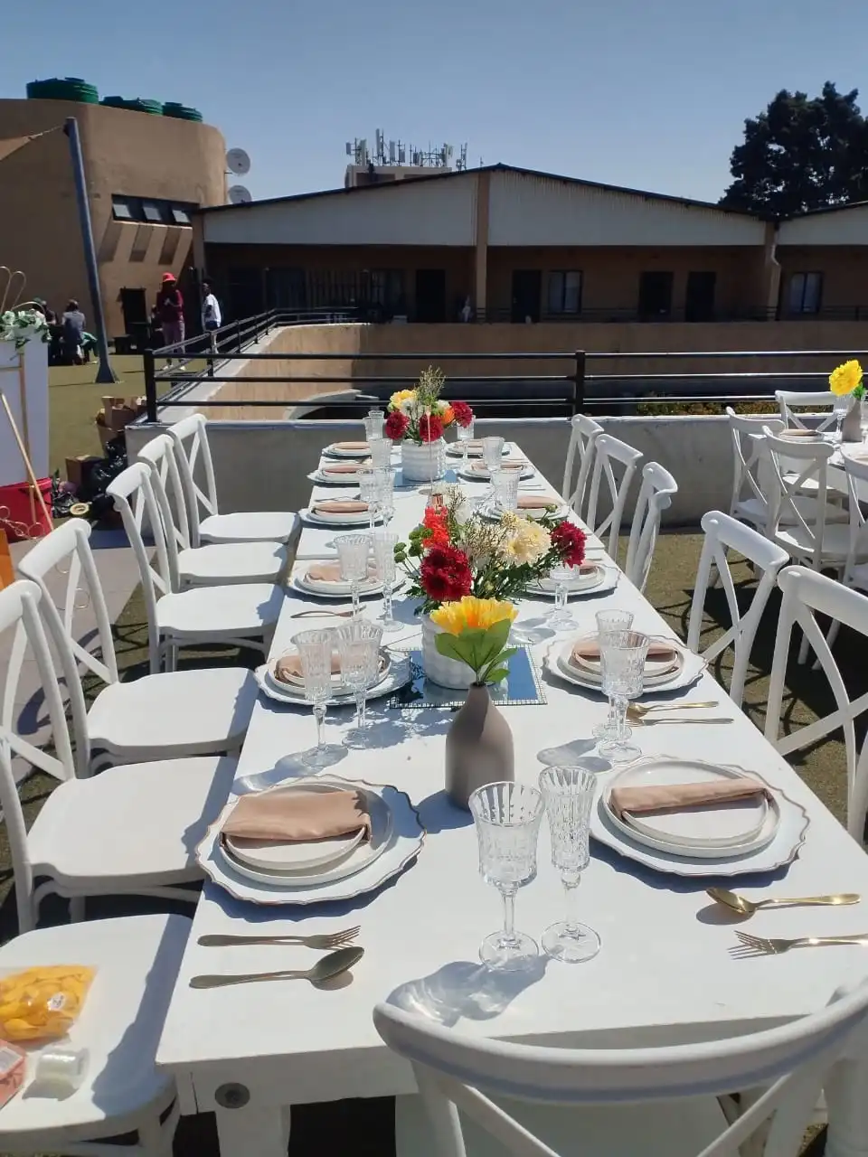 Stunning bridal shower decoration with floral arrangements and balloon arch